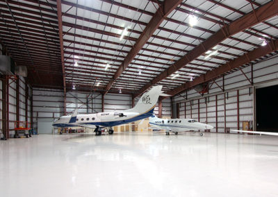 Interior picture of Galaxy Aviation prefab metal building warehouse with corrugated metal roofing by McKee GC.